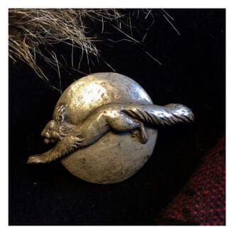 Red squirrel brooch or pin hand made in cold-cast bronze or pewter by sculptor Kirsty Armstrong