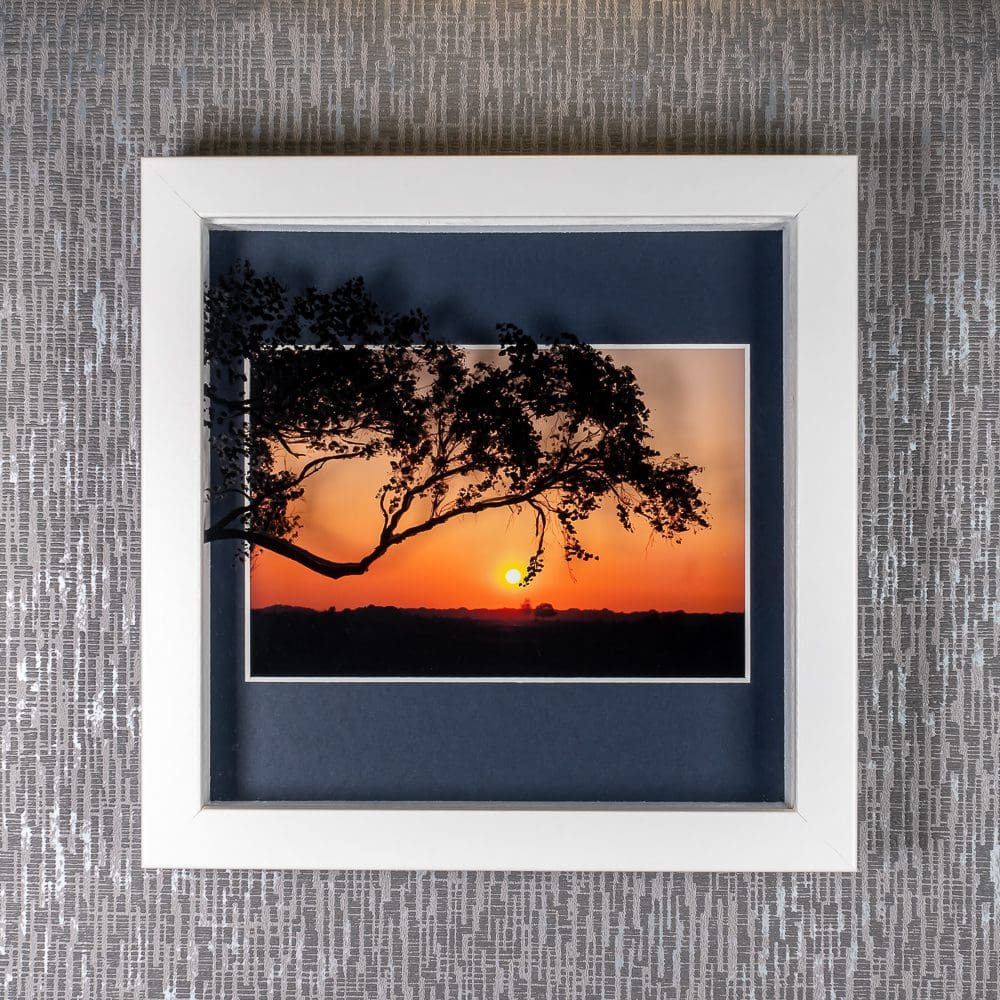 Painted Tree Silhouette throws shadows over deep orange New Forest Sunset photograph, framed artwork by Pictures2Mixtures