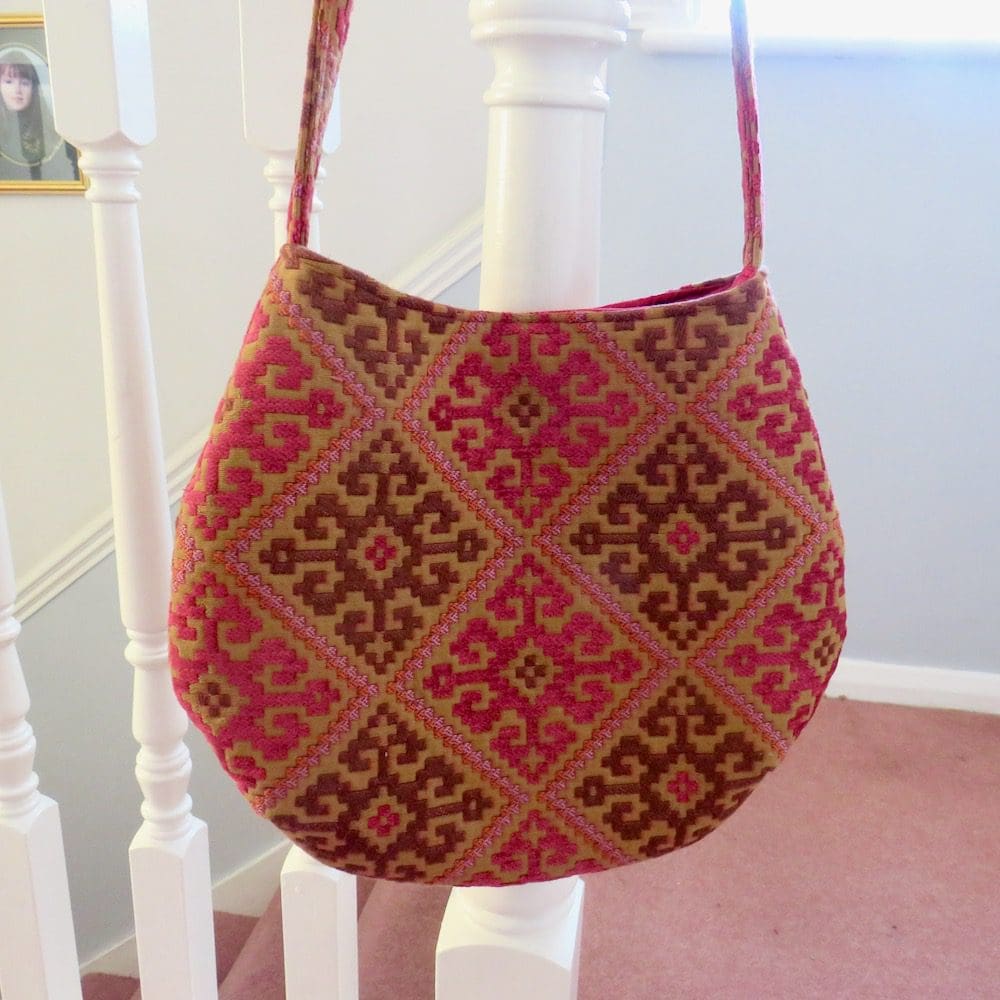 Raspberry geometric patterned slouch bag