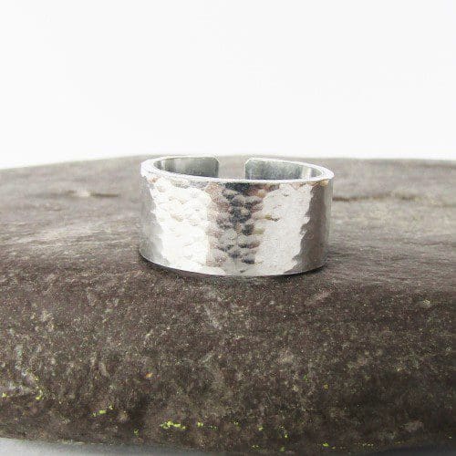 9mm wide hammered texture aluminium cuff ring with a hand-stamped hidden message inside