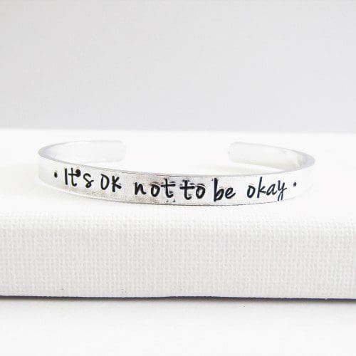6mm wide aluminium cuff bracelet hand-stamped with 'It's OK not to be okay'