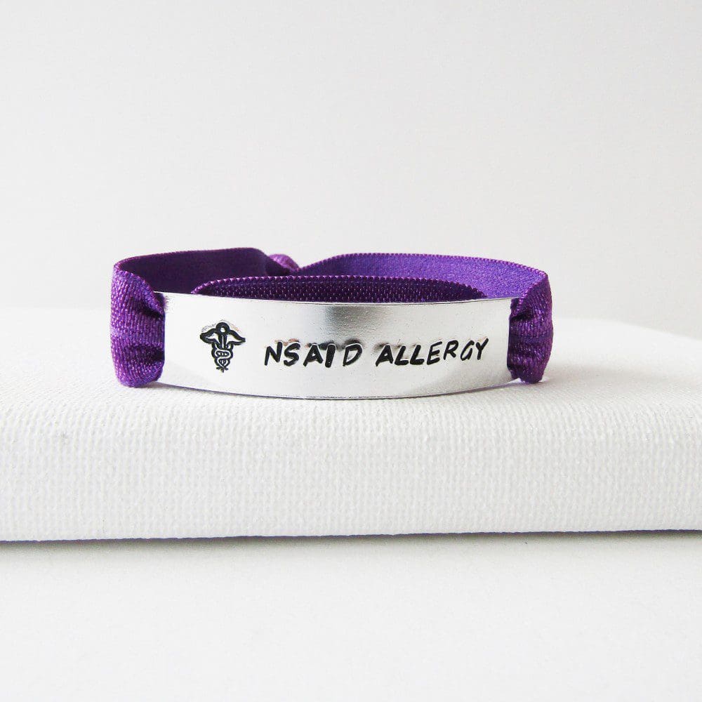 personalised hand stamped medical ID aluminium bar with an elastic stretchy bracelet