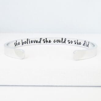 hammered 6mm aluminium bracelet with the words 'she believed she could so she did' hand-stamped inside