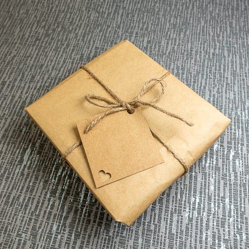 Picture gift wrapped in recycled brown craft paper tied with string or seasonal ribbon by Pictures2Mixtures