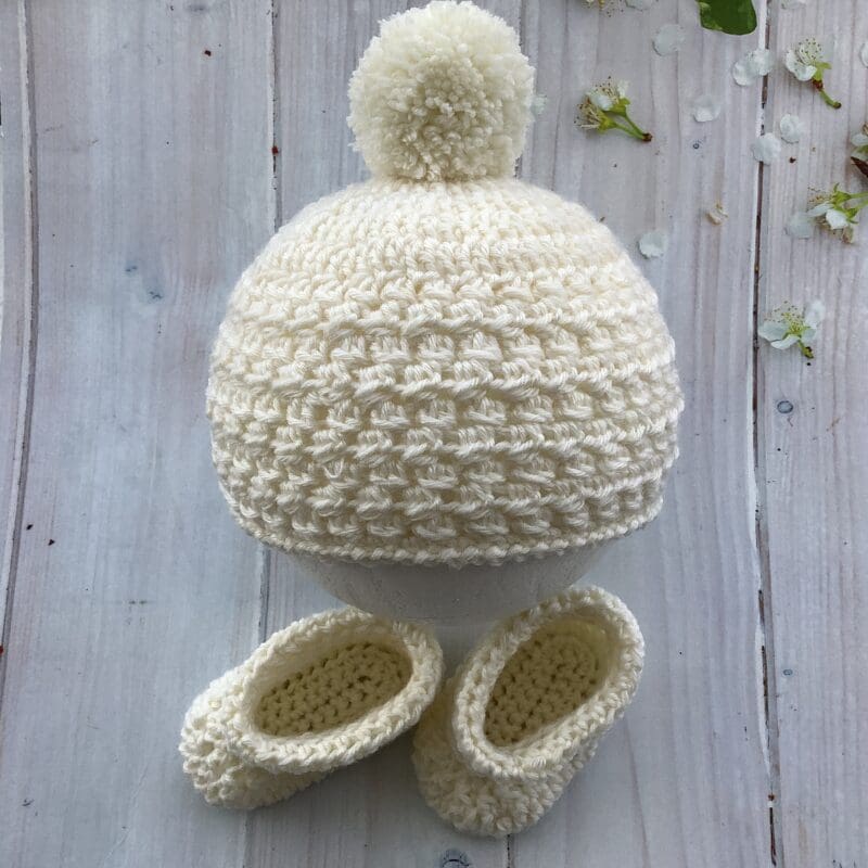 Crochet baby hat and booties in cream