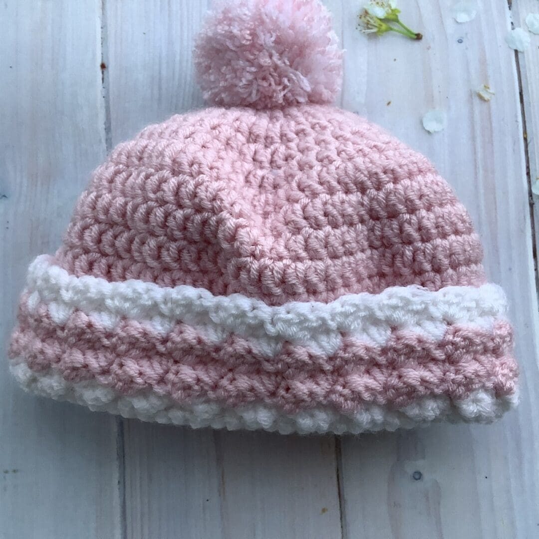 Crochet baby hat in pink and white