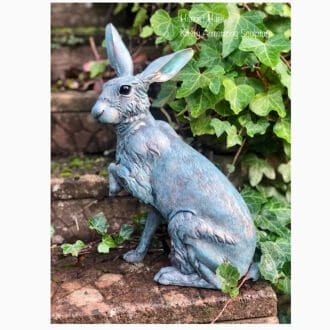 Large Hare sculpture in Bronze lacquer with a verdigris patina, in a garden setting