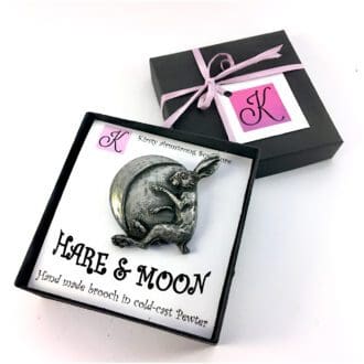 Hare and crescent moon brooch or pin in cold-cast pewter by Kirsty Armstrong Sculpture