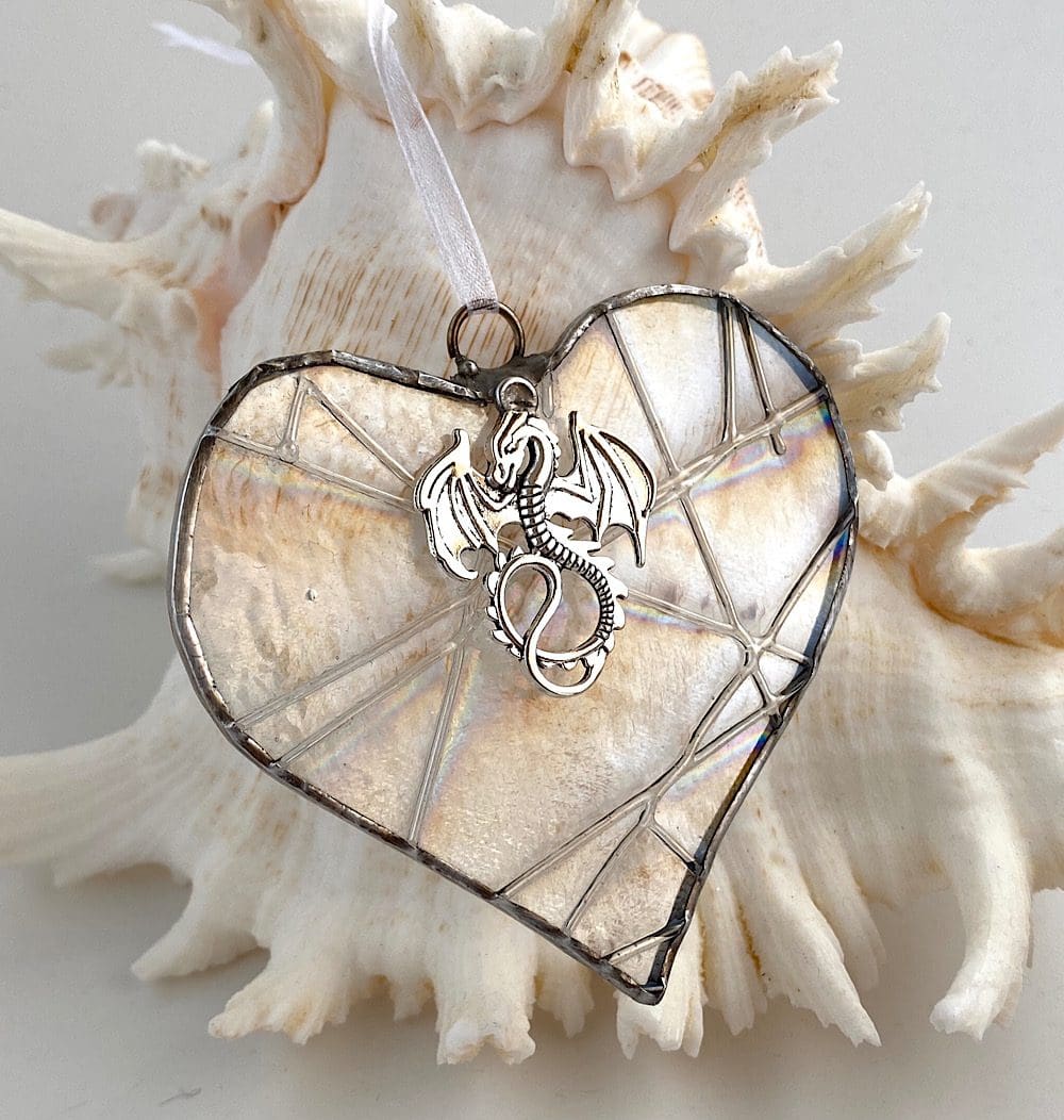 Clear glass heart with dragon charm