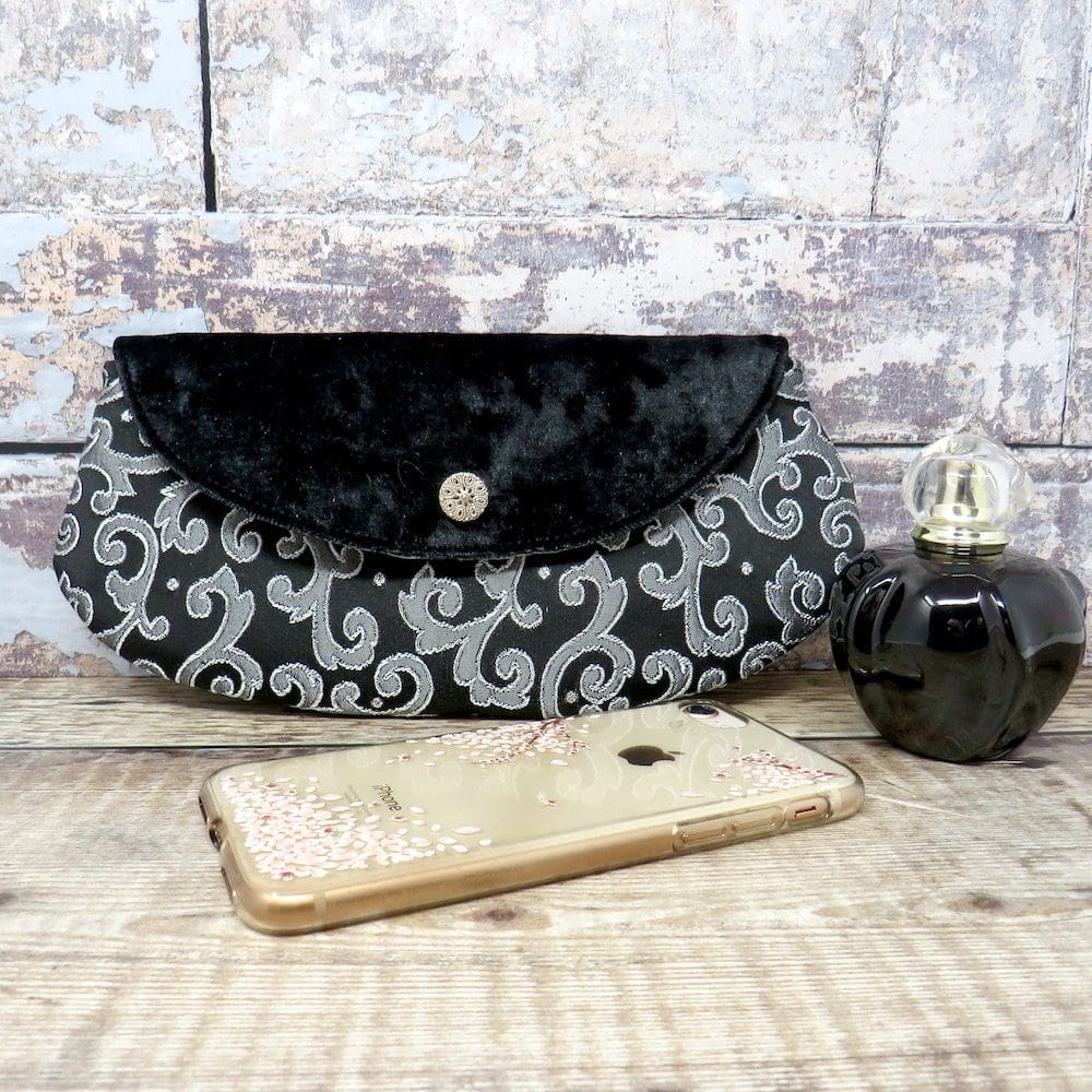 Black and silver mini clutch with a velvet flap