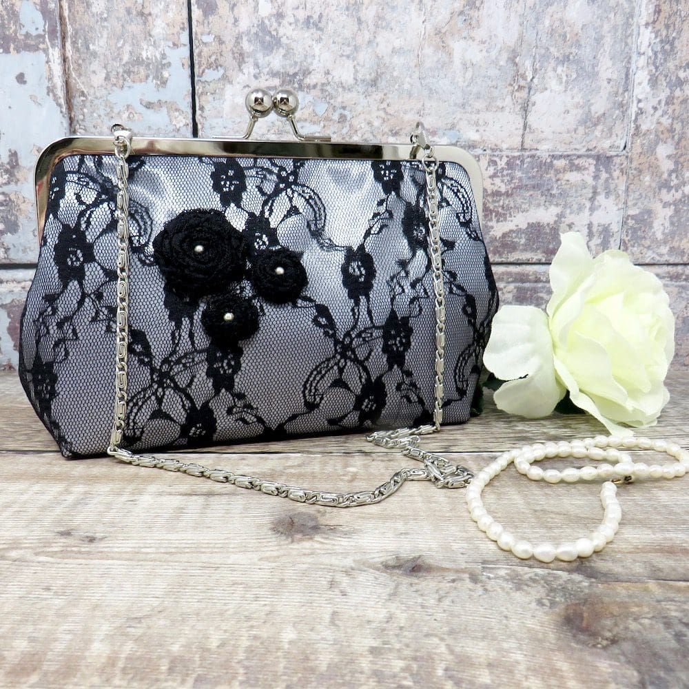 Black lace evening bag with a chain handle