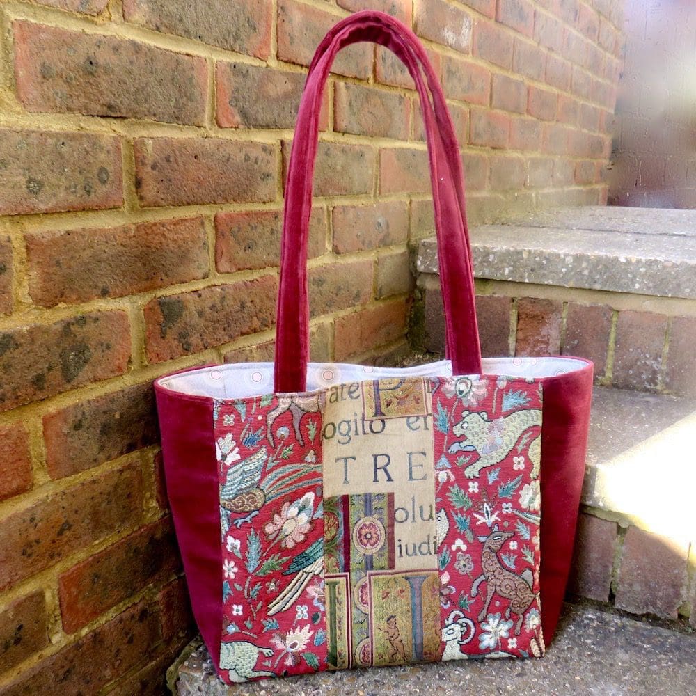 Handmade burgundy tote with medieval inspired panels