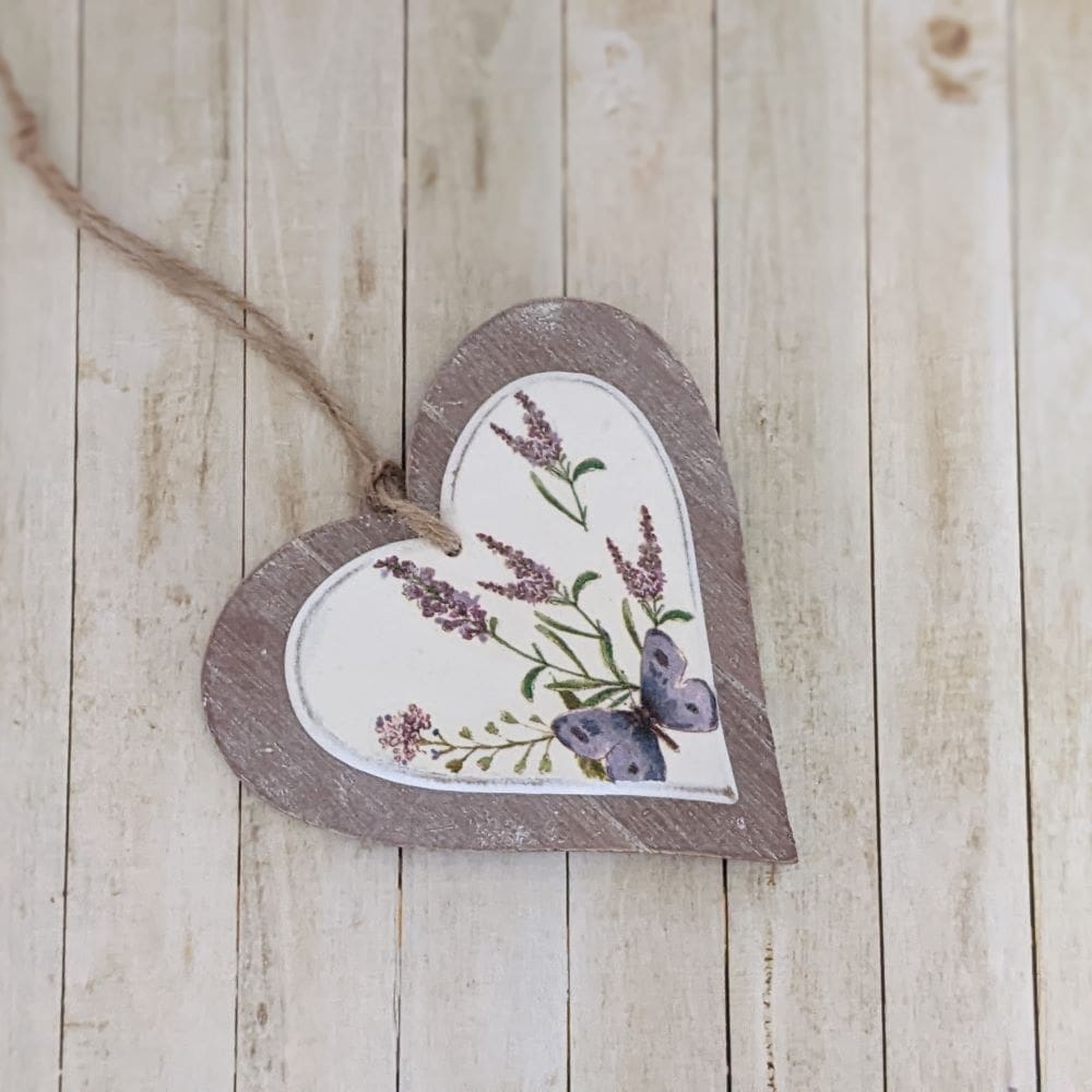 Two layer wooden hanging heart decoupaged with a butterfly and lavender design. Finished with a natural twine hanger.