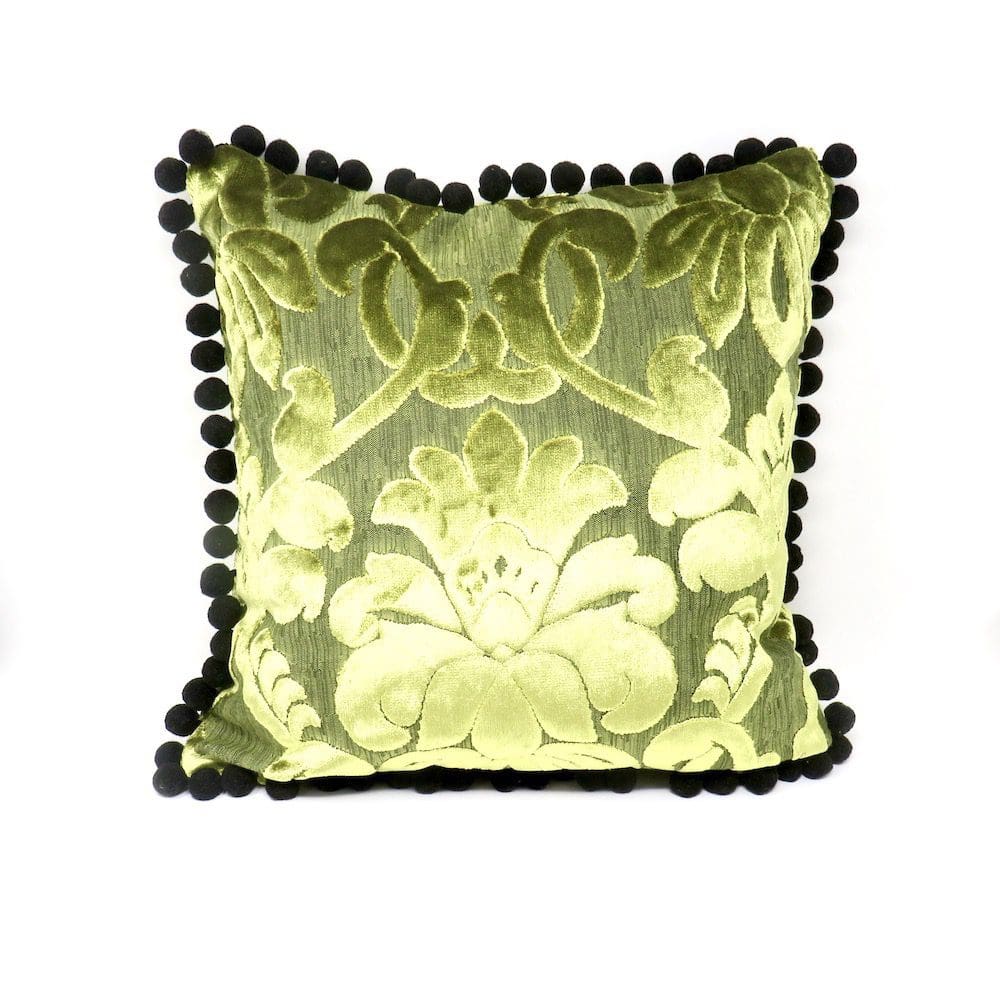 Luxurious cushion handmade in chartreuse velvet and with a black pom pom trim