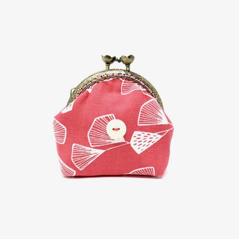 Coral pink coin purse with a bead and flower clasp