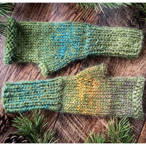 Olive fluffy handwarmers with variegated yarn running through of browns and golds