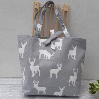 Large tote, white stags on grey background, reversible to grey stripes
