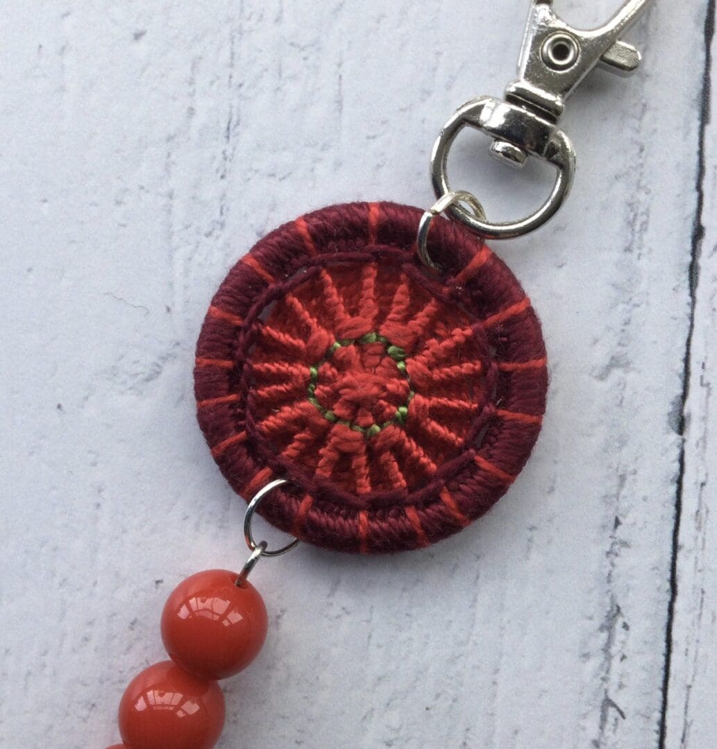 Dorset button with tassel bag charm
