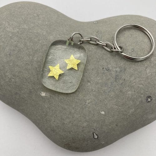 Gold stars on clear glass keyring