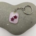 Pink keyring with copper stars (version 1)