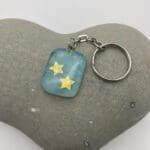 Turquoise keyring with gold stars