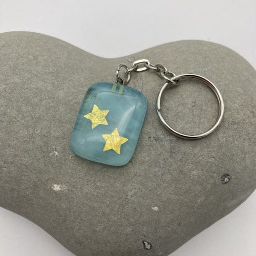 Gold stars on turquoise fused glass keyring