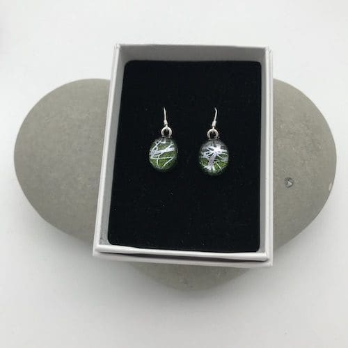 Green with silver swirl pattern dangly earrings