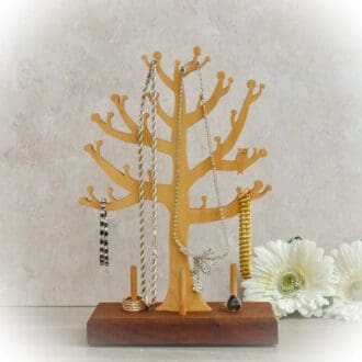 Jewellery Tree and Ring stand, cut from ply using a scroll saw and set onto a dark wood base.