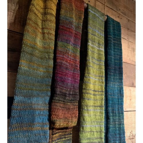 Selection of light weight knitted scarves in different shades of variegated Italian yarns