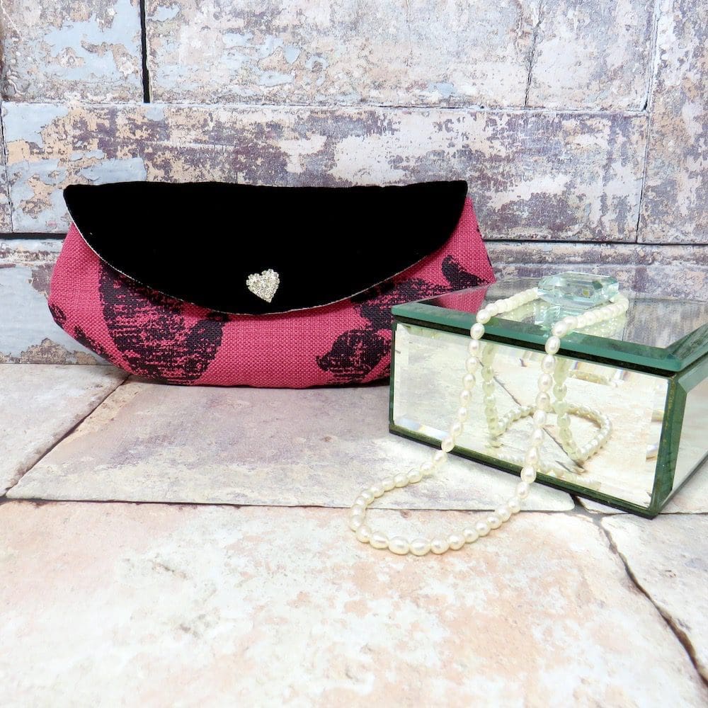 Handmade mini clutch bag in raspberry and black