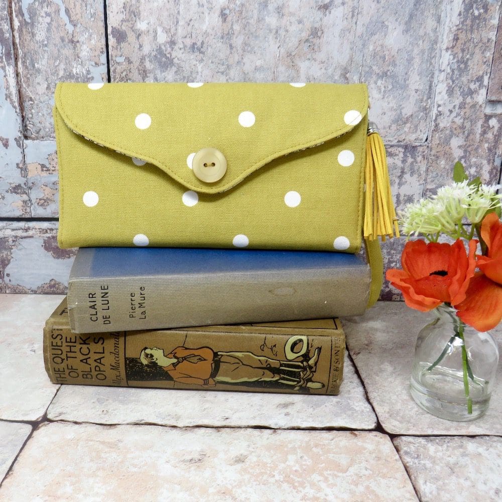 Handmade clutch wallet in a mustard and white spot fabric