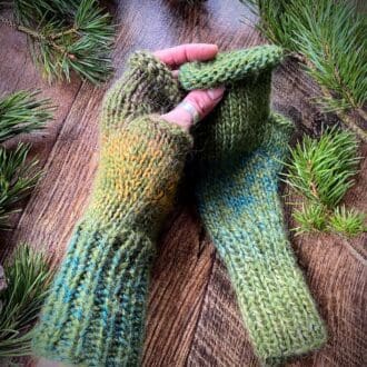 Hand knitted fluffy olive green fingerless gloves with variegated strands of greens, browns and golds