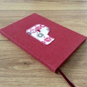 An initial notebook handmade with plain paper