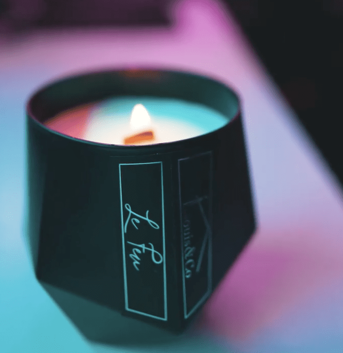 Discover Louis & Co Maison - a Le Feu candle burning with a wooden wick