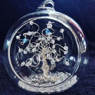 Silver wire tree decorated with clear crystals and birthstones with a clear crystal heart wired in near the roots set into an 8cm open fronted glass bauble.