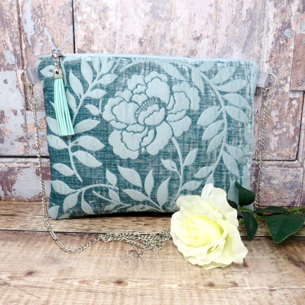 Handmade turquoise velvet clutch with a chain handle