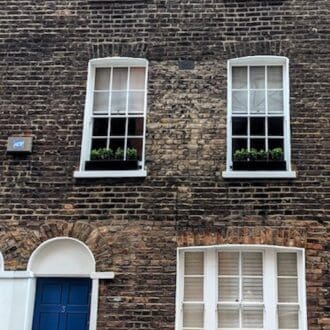 Terraced House with Window Sill Boxes in Black