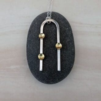 handmade sterling silver wire and brass drop necklace