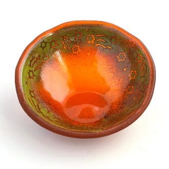 Orange fused glass bowl with shooting stars design