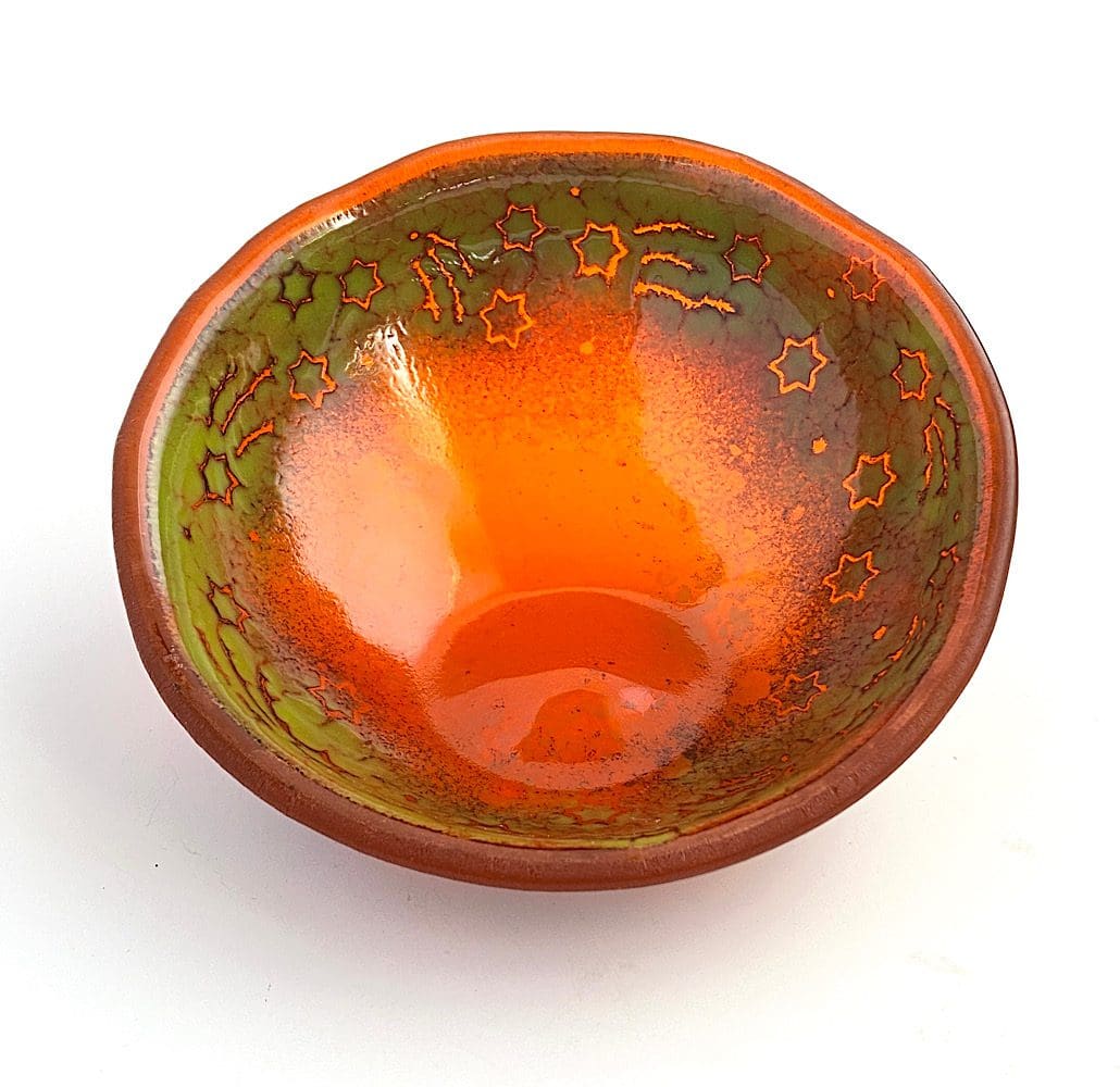 Orange fused glass bowl with shooting stars design