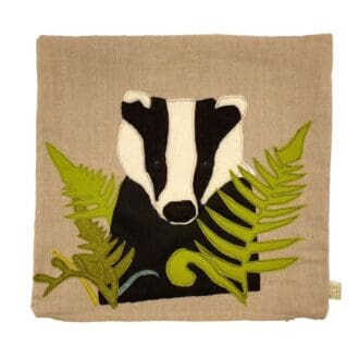 Applique badger and leaves on a linen cusion
