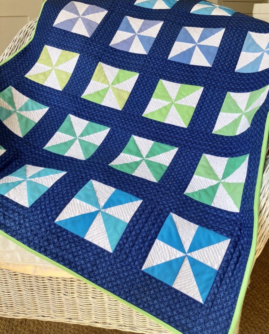 Blue pinwheel modern baby quilt