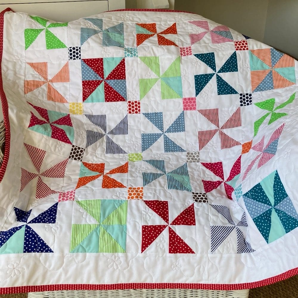 Modern bright pinwheel baby quilt