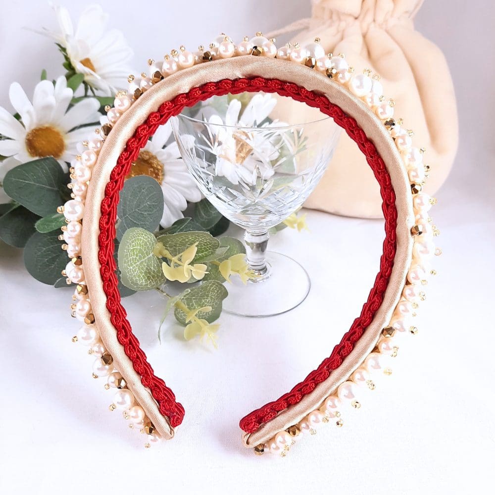 Wide band headband covered in pearls and gold crystals