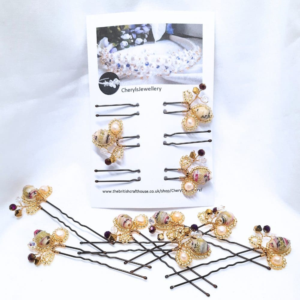 Hair pins in shades of cream with crystal and gold.