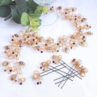 Hair vine and pins in shades of cream with crystal and gold.