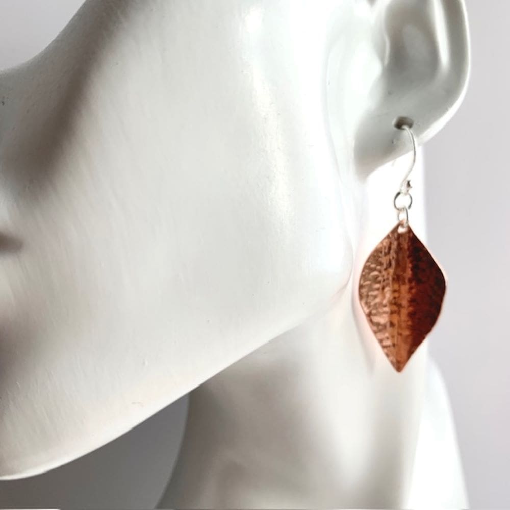 Dimpled copper leaf dangly earrings