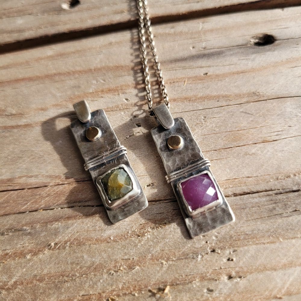 Silver, gold and sapphire pendant