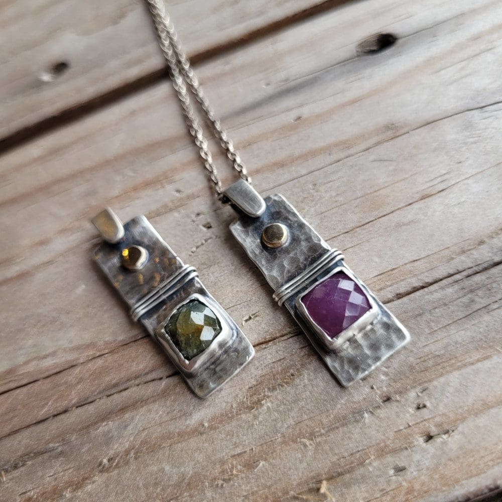 Silver, gold and sapphire pendant