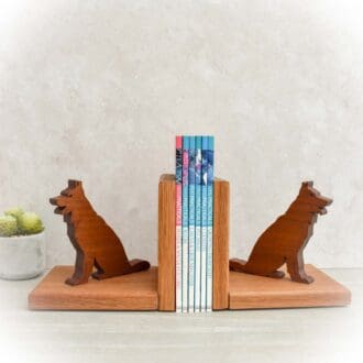 Wooden Bookends with a German Shepherd Dog figure sat on each one.
